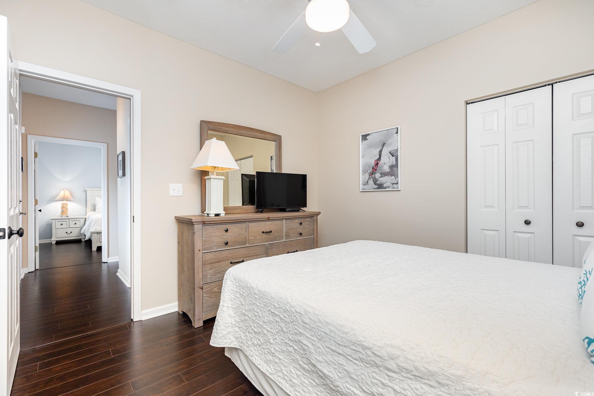 2478 Coastline Court, Unit 202 Murrells Inlet, SC 29576 - Photo 17 of 33 Bedroom featuring a closet, ceiling fan, and dark