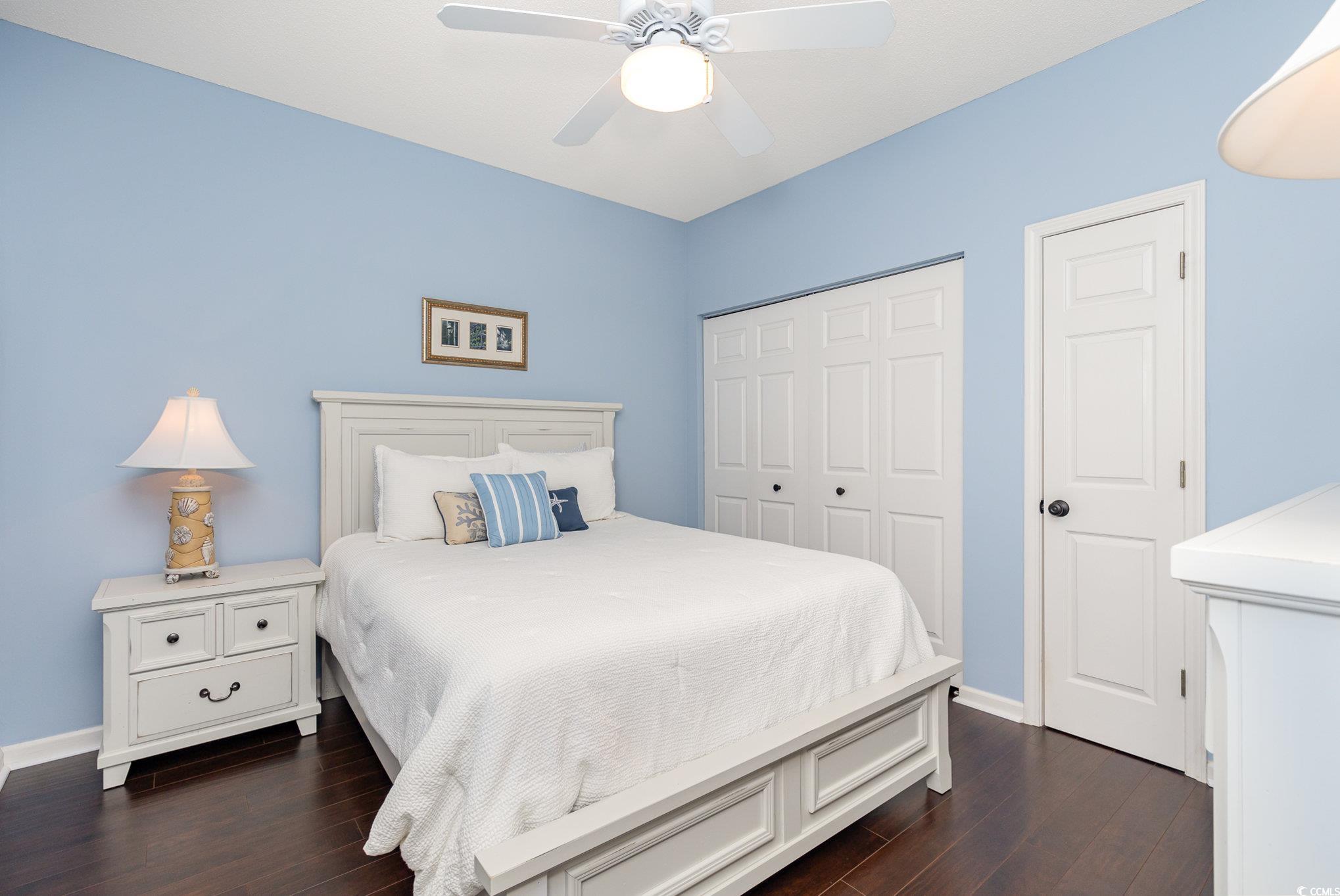 2478 Coastline Court, Unit 202 Murrells Inlet, SC 29576 - Photo 19 of 33 Bedroom featuring ceiling fan and dark wood-type f