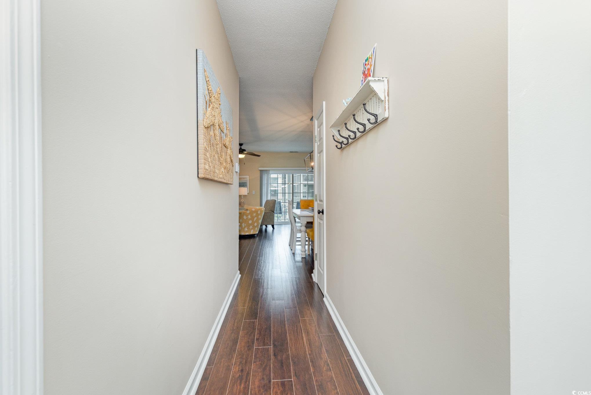 2478 Coastline Court, Unit 202 Murrells Inlet, SC 29576 - Photo 23 of 33 Corridor featuring dark hardwood / wood-style floo