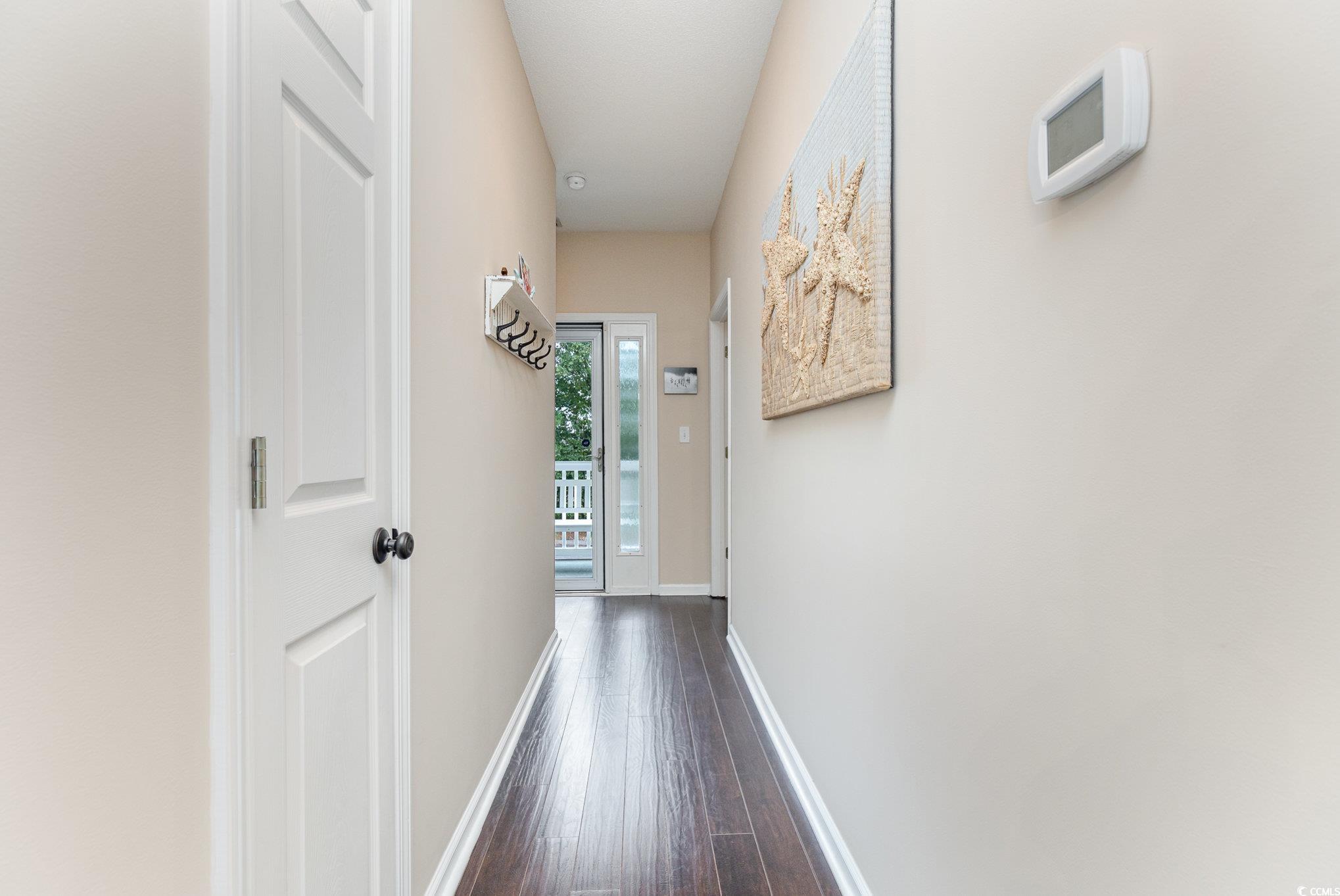 2478 Coastline Court, Unit 202 Murrells Inlet, SC 29576 - Photo 24 of 33 Hallway featuring dark wood-type flooring