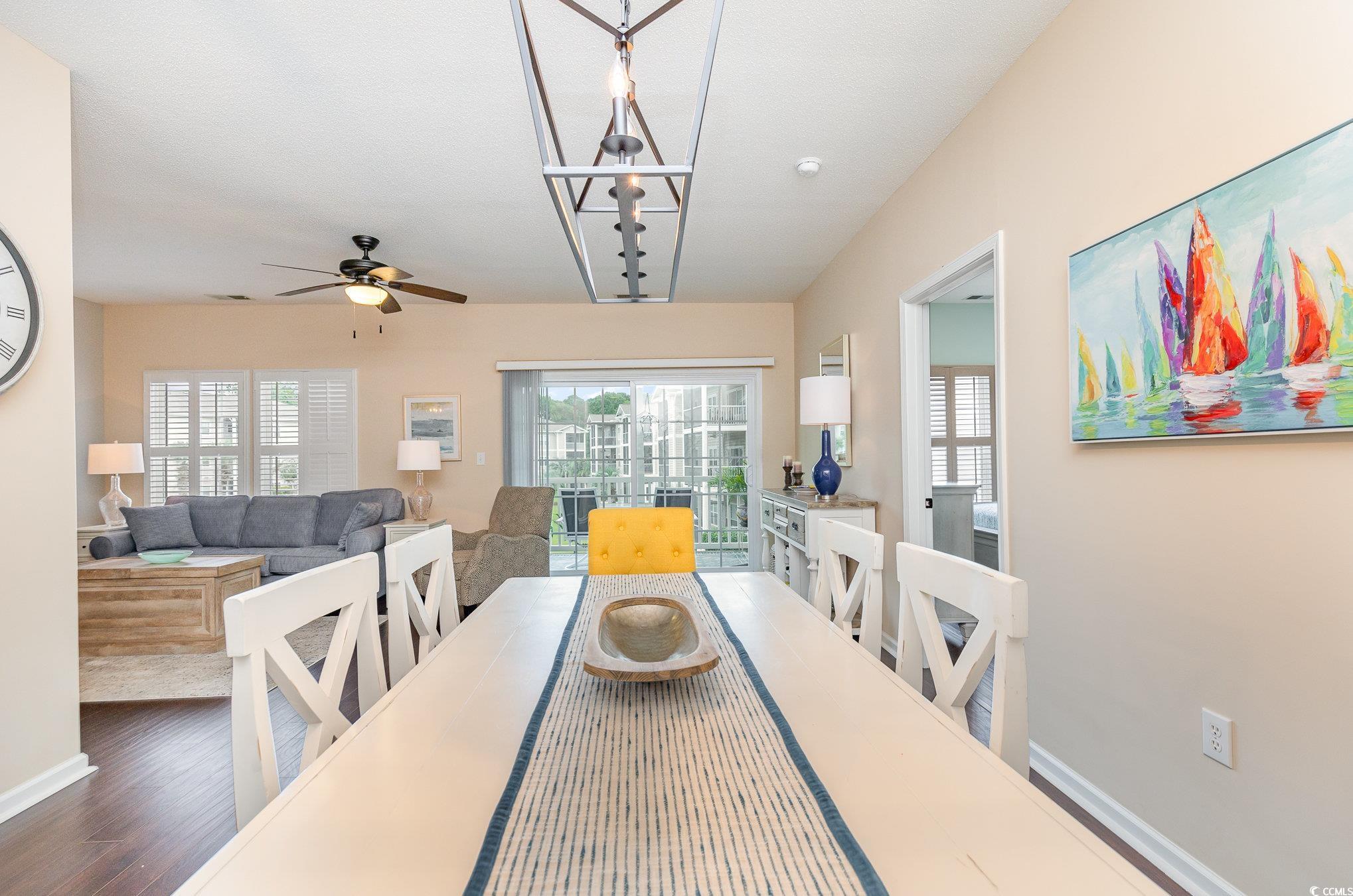 2478 Coastline Court, Unit 202 Murrells Inlet, SC 29576 - Photo 6 of 33 Dining area featuring ceiling fan, plenty of natur