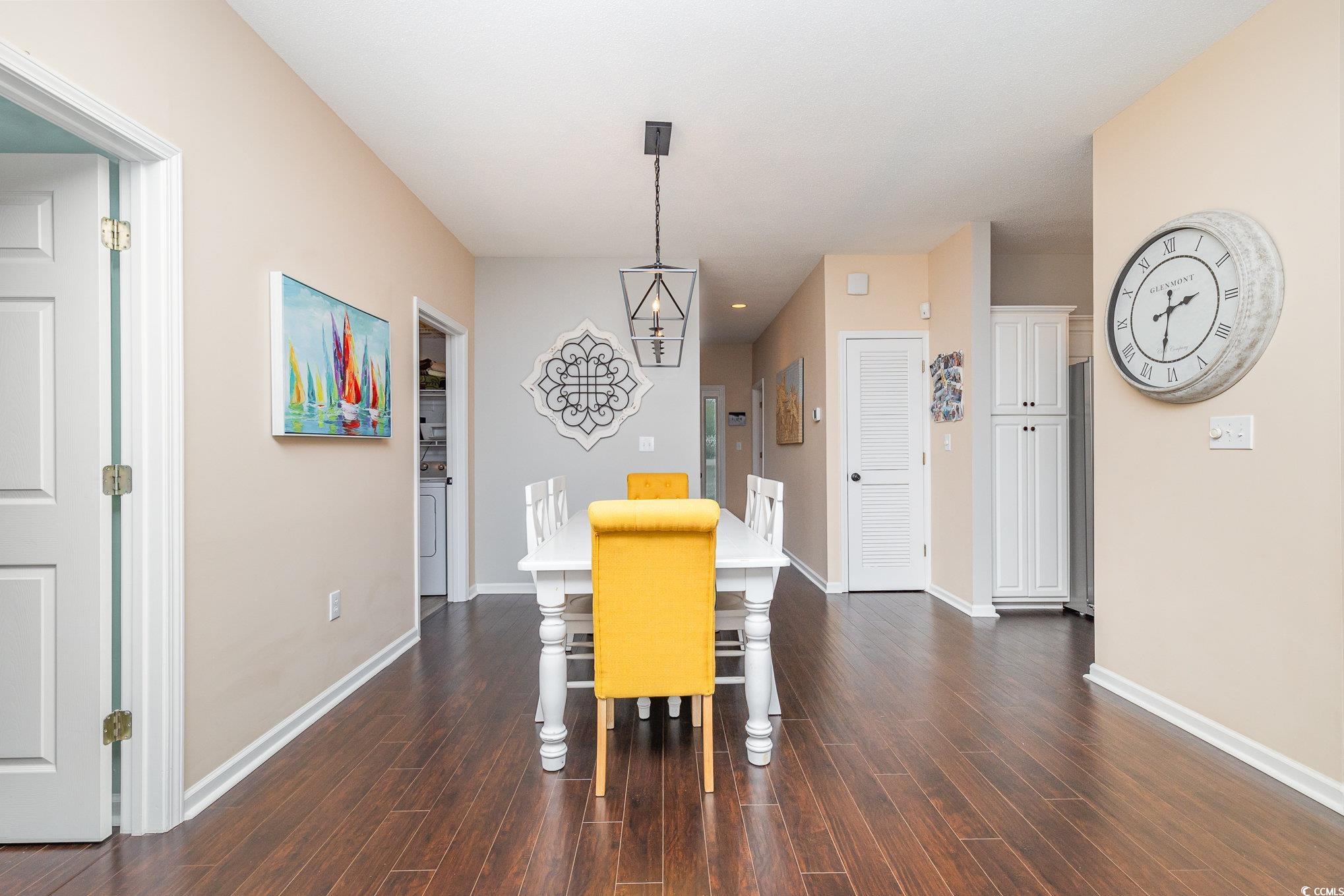 2478 Coastline Court, Unit 202 Murrells Inlet, SC 29576 - Photo 7 of 33 Dining space featuring dark hardwood / wood-style