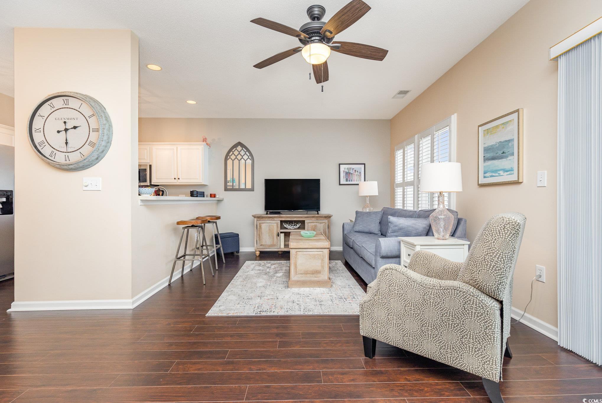 2478 Coastline Court, Unit 202 Murrells Inlet, SC 29576 - Photo 9 of 33 Living room featuring ceiling fan and dark hardwoo