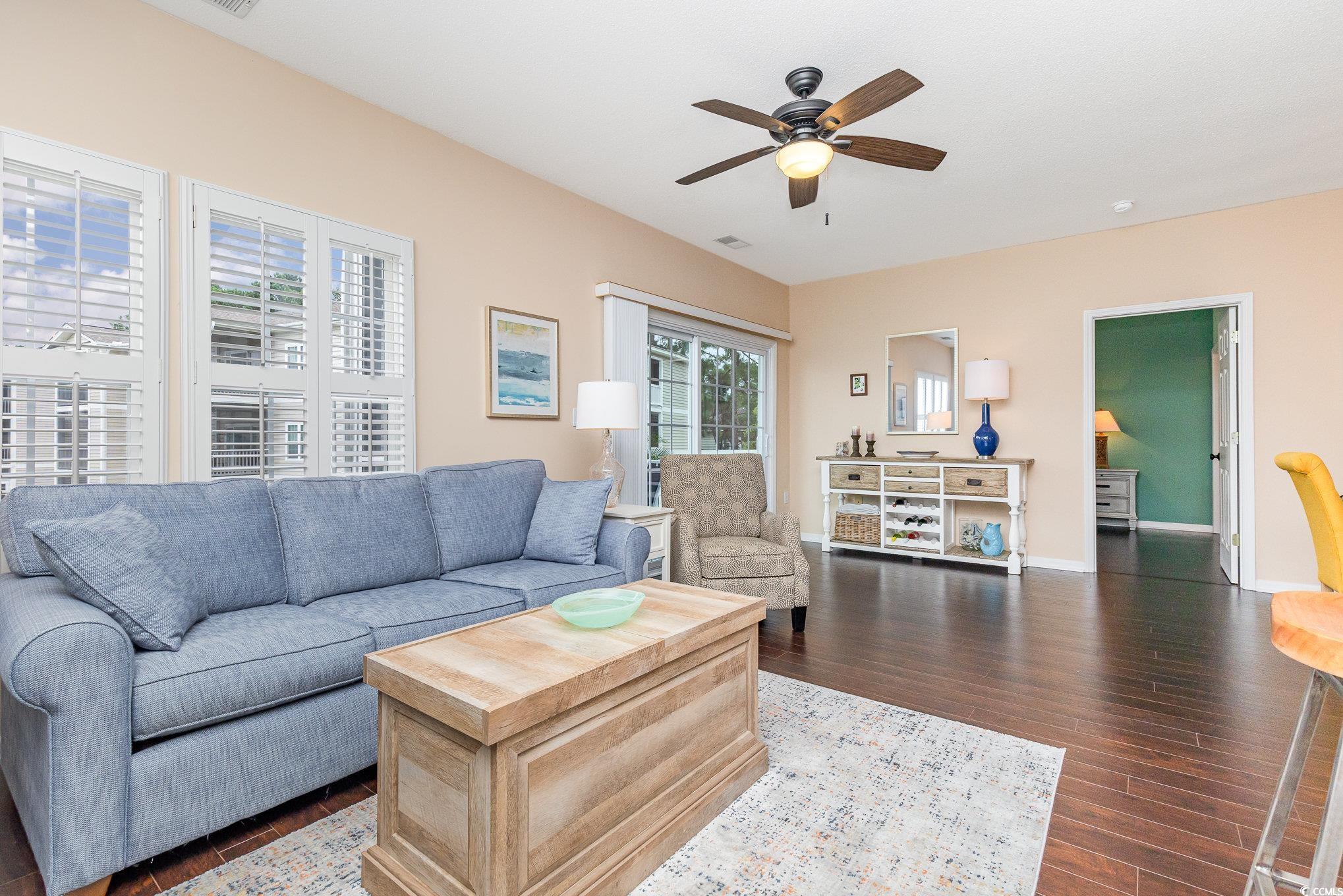 2478 Coastline Court, Unit 202 Murrells Inlet, SC 29576 - Photo 10 of 33 Living room with ceiling fan and dark hardwood / w