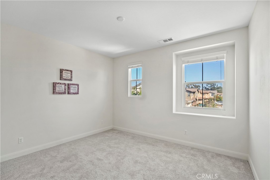 6670 Meadowlane Place Rancho Cucamonga, CA 91701 - Photo 18 of 26 an empty room with windows