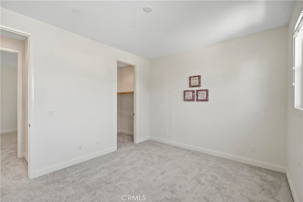 6670 Meadowlane Place Rancho Cucamonga, CA 91701 - Photo 20 of 26 an empty room with a hallway
