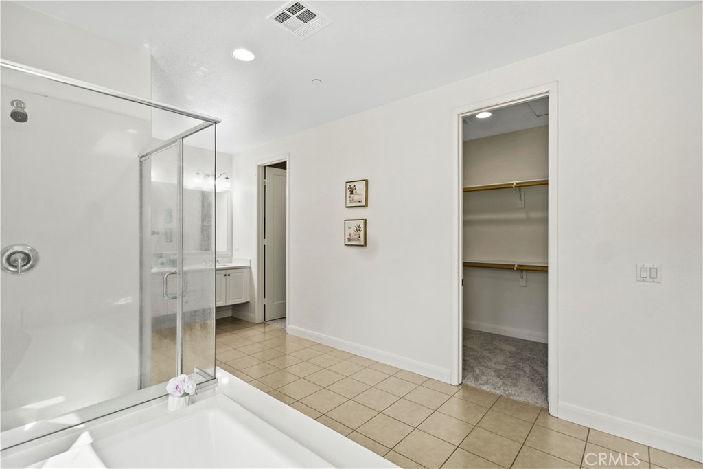 6670 Meadowlane Place Rancho Cucamonga, CA 91701 - Photo 22 of 26 a bathroom with a shower and a sink