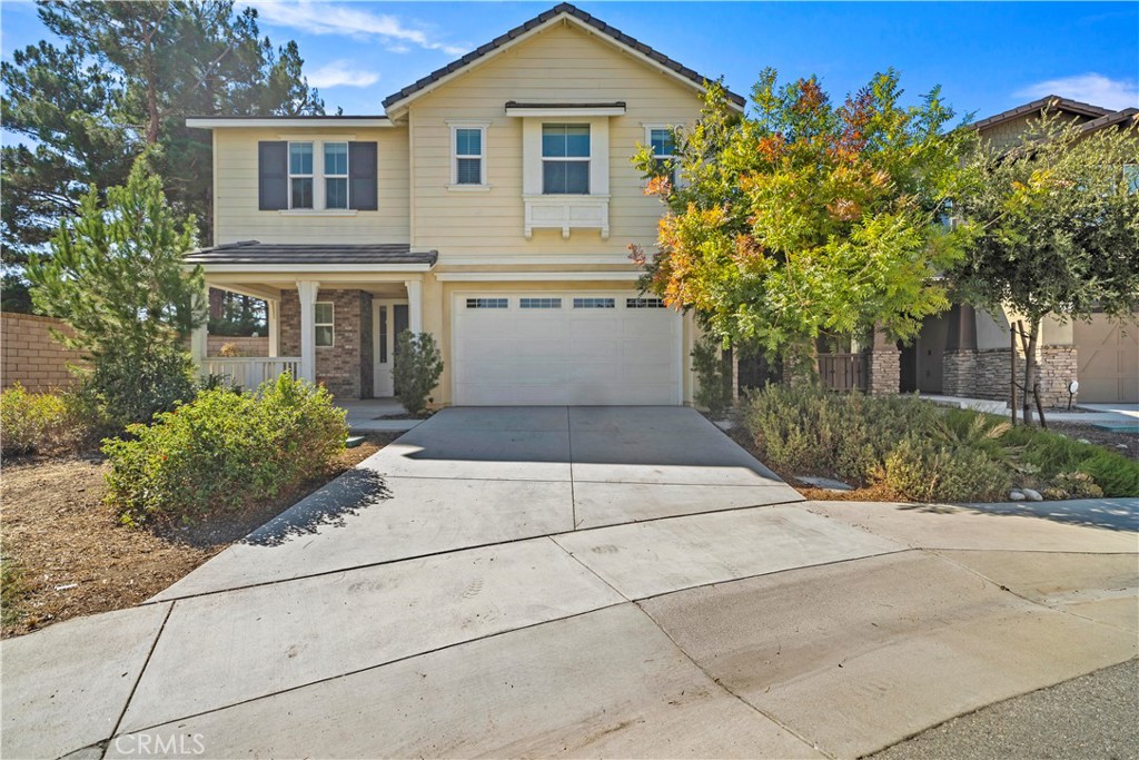 6670 Meadowlane Place Rancho Cucamonga, CA 91701 - Photo 26 of 26 a view of a house with a yard