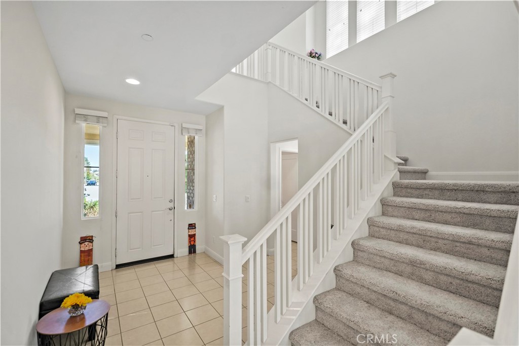 6670 Meadowlane Place Rancho Cucamonga, CA 91701 - Photo 3 of 26 a view of entryway with wooden floor and stairs