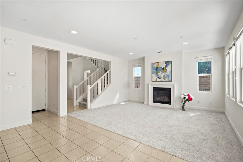 6670 Meadowlane Place Rancho Cucamonga, CA 91701 - Photo 7 of 26 a view of an empty room with fireplace and a window