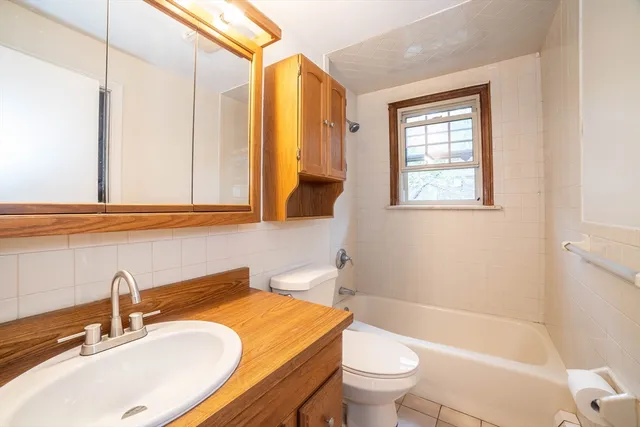 a bathroom with a sink a toilet and a bathtub