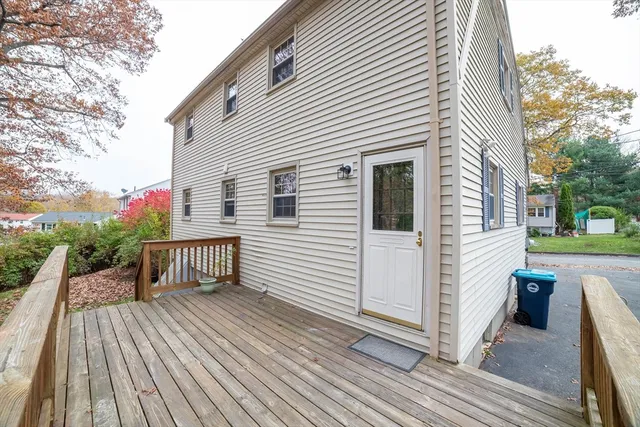 a view of a wooden deck with a yard