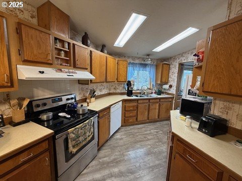 1199 North Terry Street, Unit 139 Eugene, OR 97402 - Photo 12 of 23 a kitchen with a sink a stove and cabinets