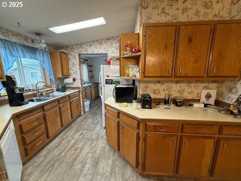1199 North Terry Street, Unit 139 Eugene, OR 97402 - Photo 13 of 23 a kitchen with stainless steel appliances granite countertop a stove a sink dishwasher and a refrigerator