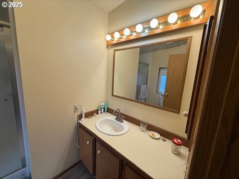 1199 North Terry Street, Unit 139 Eugene, OR 97402 - Photo 20 of 23 a bathroom with a sink vanity and a mirror