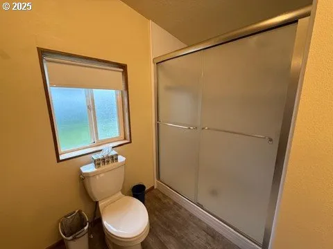 a white toilet sitting next to a bathroom sink