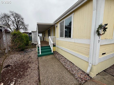 1199 North Terry Street, Unit 139 Eugene, OR 97402 - Photo 3 of 23 a view of a house with a yard