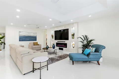 a living room with furniture flowerpot and a potted plant