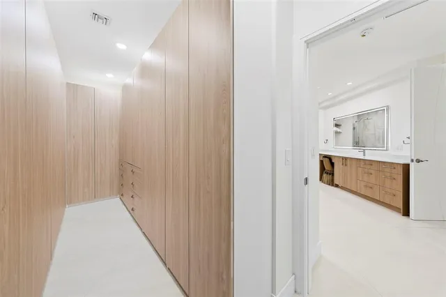 a kitchen with a refrigerator and a sink