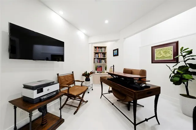 a front view of house with yard and outdoor seating