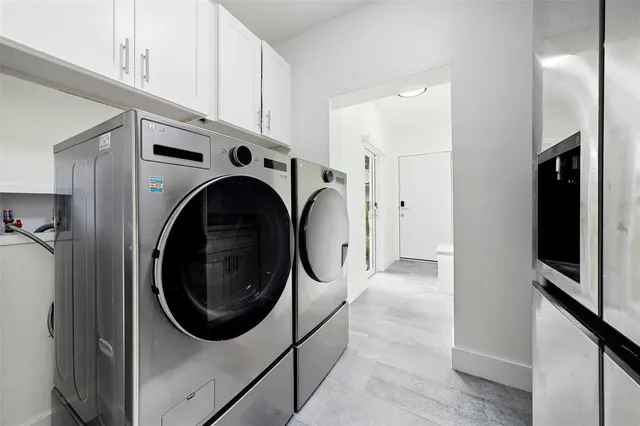 a picture of a room with a white wall and a painting