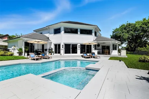 a front view of a house with a yard table and chairs