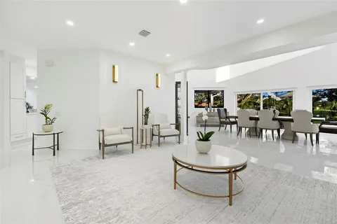 a living room with furniture and white walls