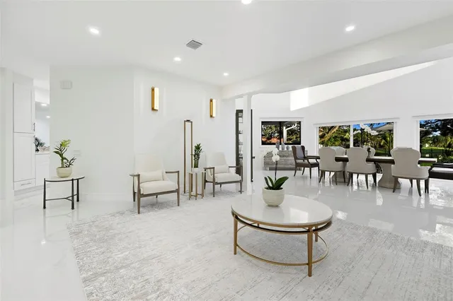 a living room with furniture and white walls