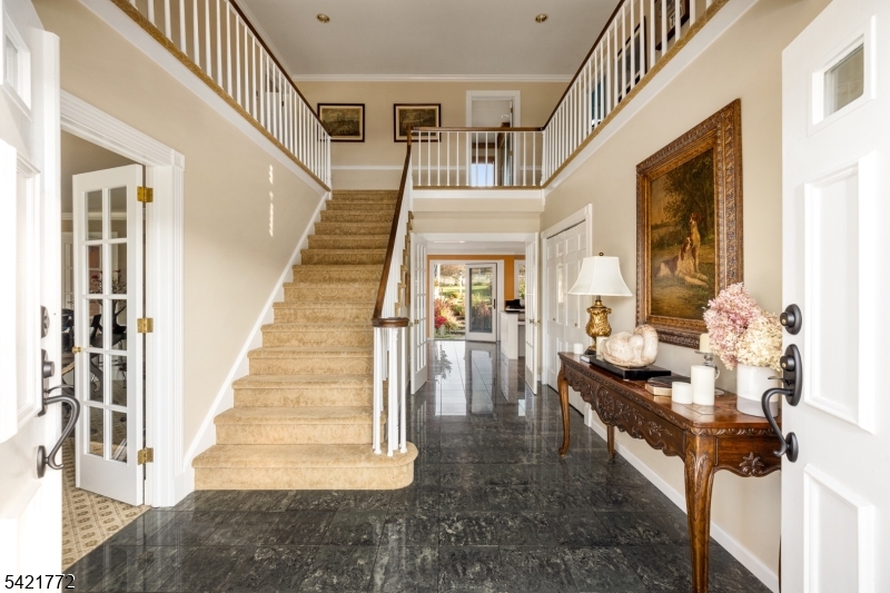 112 Quarry Road Wantage, NJ 07461 - Photo 15 of 24 a dining room with wooden floor and stairs