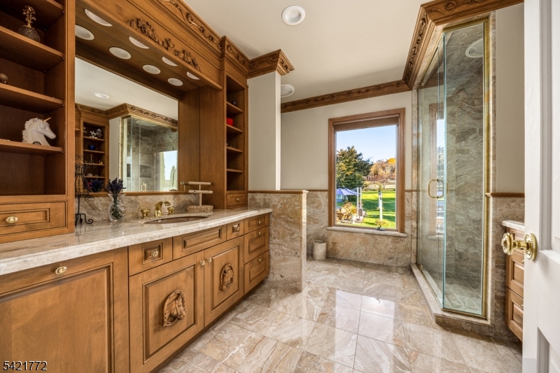 112 Quarry Road Wantage, NJ 07461 - Photo 22 of 24 a spacious bathroom with a granite countertop sink mirror and shower