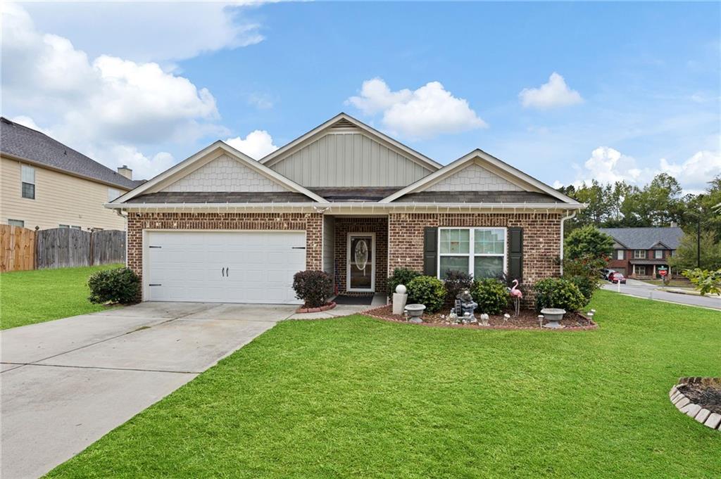 a front view of a house with garden