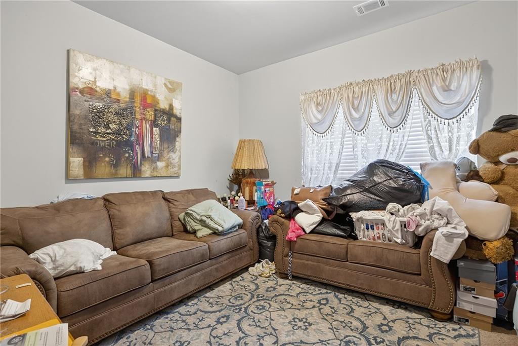 89 Dundee Crossing Dallas, GA 30132 - Photo 11 of 30 a living room with furniture and a window