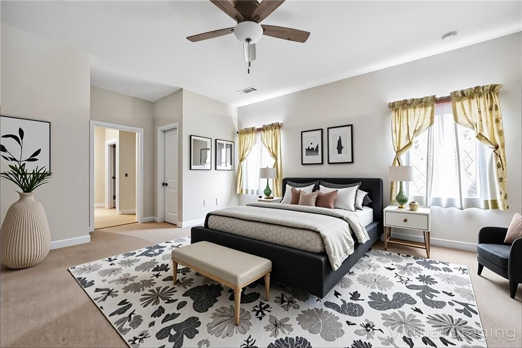 89 Dundee Crossing Dallas, GA 30132 - Photo 19 of 30 a spacious bedroom with a bed a couch and a window