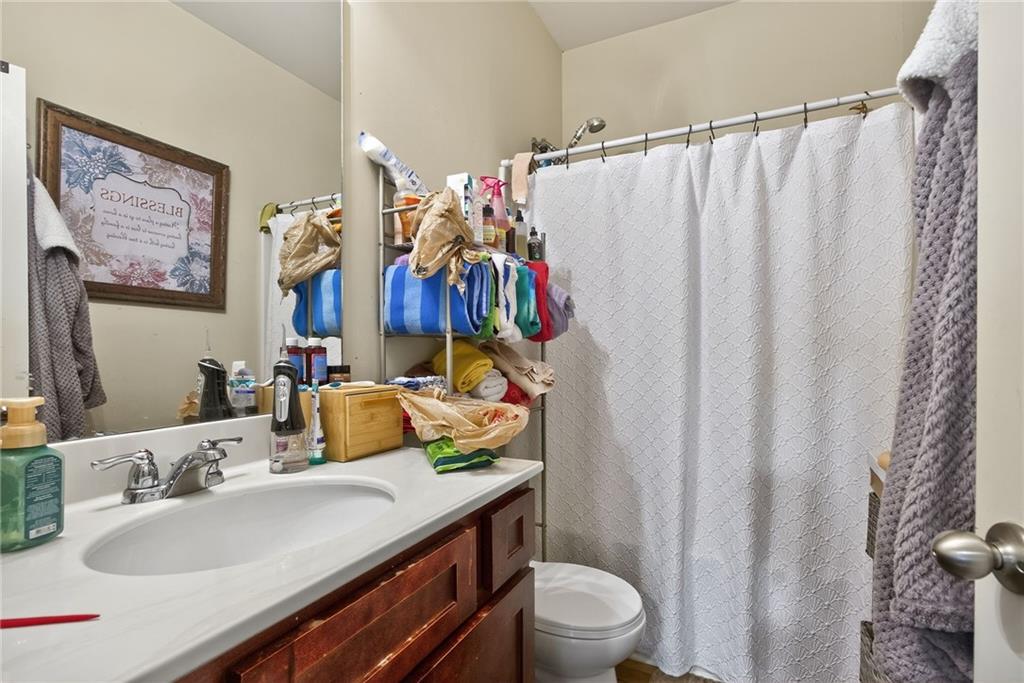 89 Dundee Crossing Dallas, GA 30132 - Photo 25 of 30 a bathroom with a sink vanity mirror and toilet