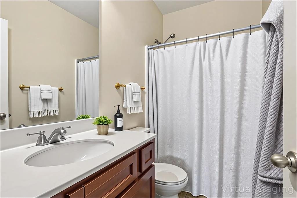 89 Dundee Crossing Dallas, GA 30132 - Photo 26 of 30 a bathroom with a granite countertop sink and a mirror with toilet