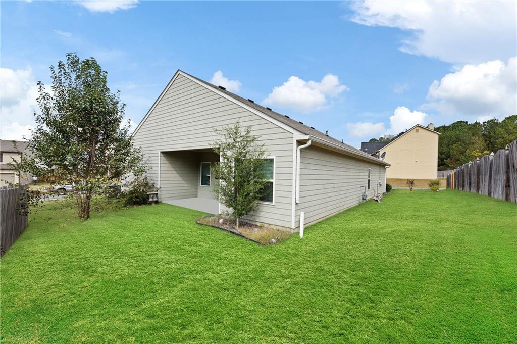 89 Dundee Crossing Dallas, GA 30132 - Photo 28 of 30 a front view of house with yard and outdoor seating
