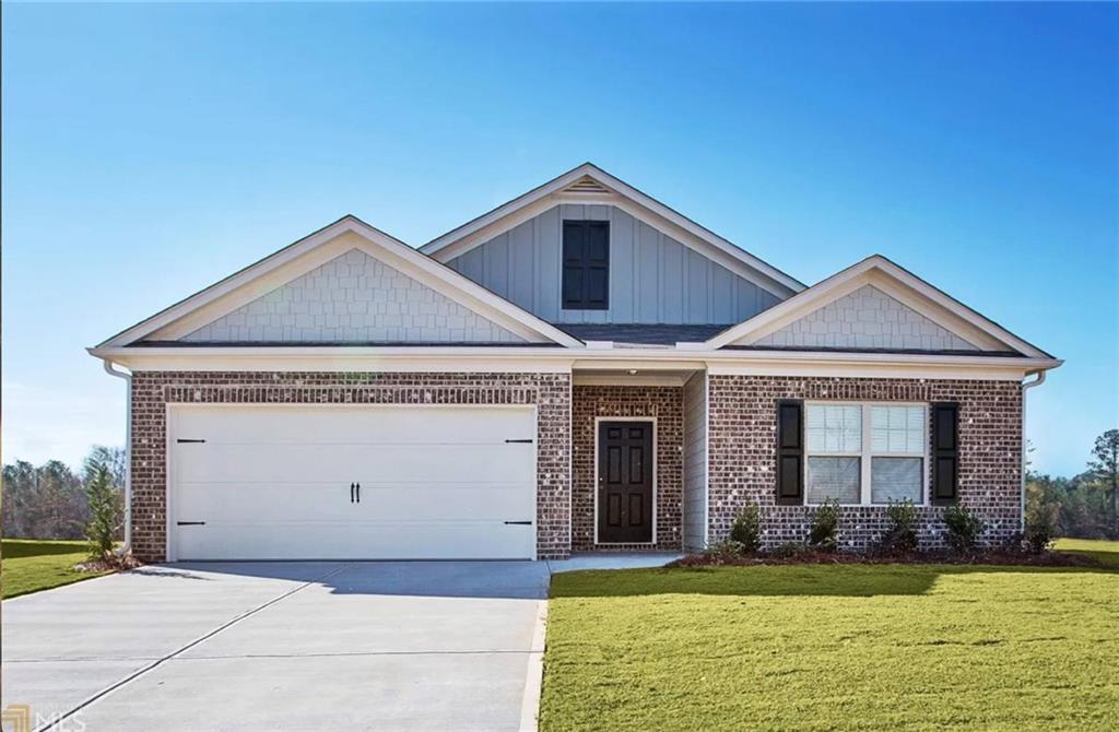 89 Dundee Crossing Dallas, GA 30132 - Photo 29 of 30 a front view of a house with a yard and garage