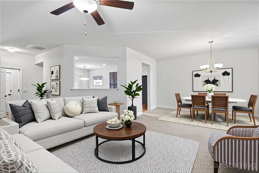 89 Dundee Crossing Dallas, GA 30132 - Photo 6 of 30 a living room with furniture potted plant and white walls