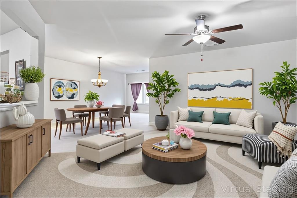 89 Dundee Crossing Dallas, GA 30132 - Photo 8 of 30 a living room with furniture and a chandelier