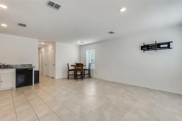 an empty room with furniture and windows