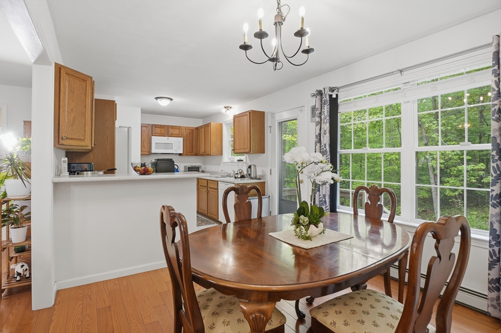 186 Common Street Groton, MA 01450 - Photo 13 of 28 a view of a dining room with furniture window and outside view