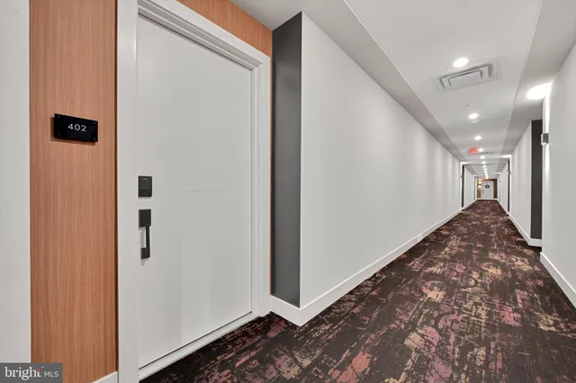 a view of a hallway to a bedroom