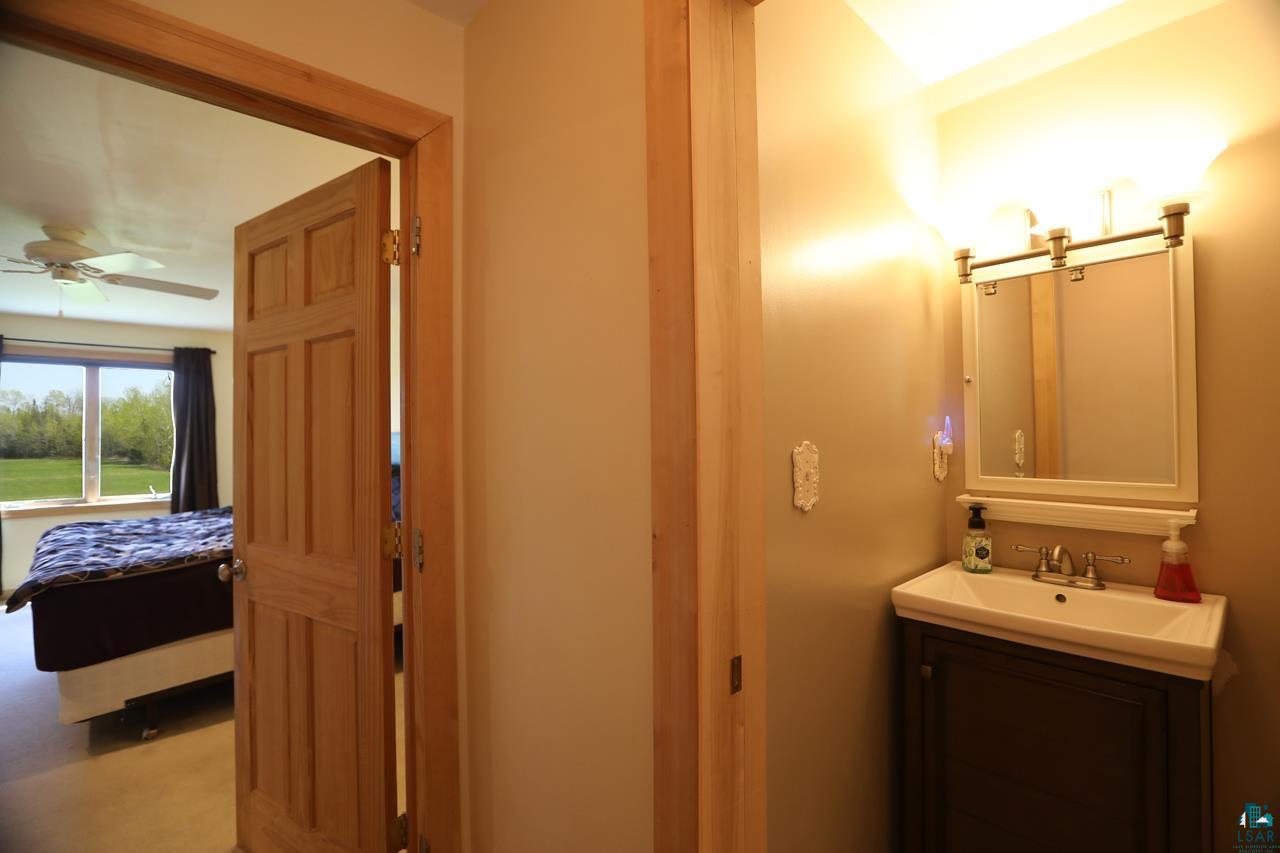 10362 Arkola Road Meadowlands, MN 55765 - Photo 15 of 30 Bathroom with ceiling fan and vanity