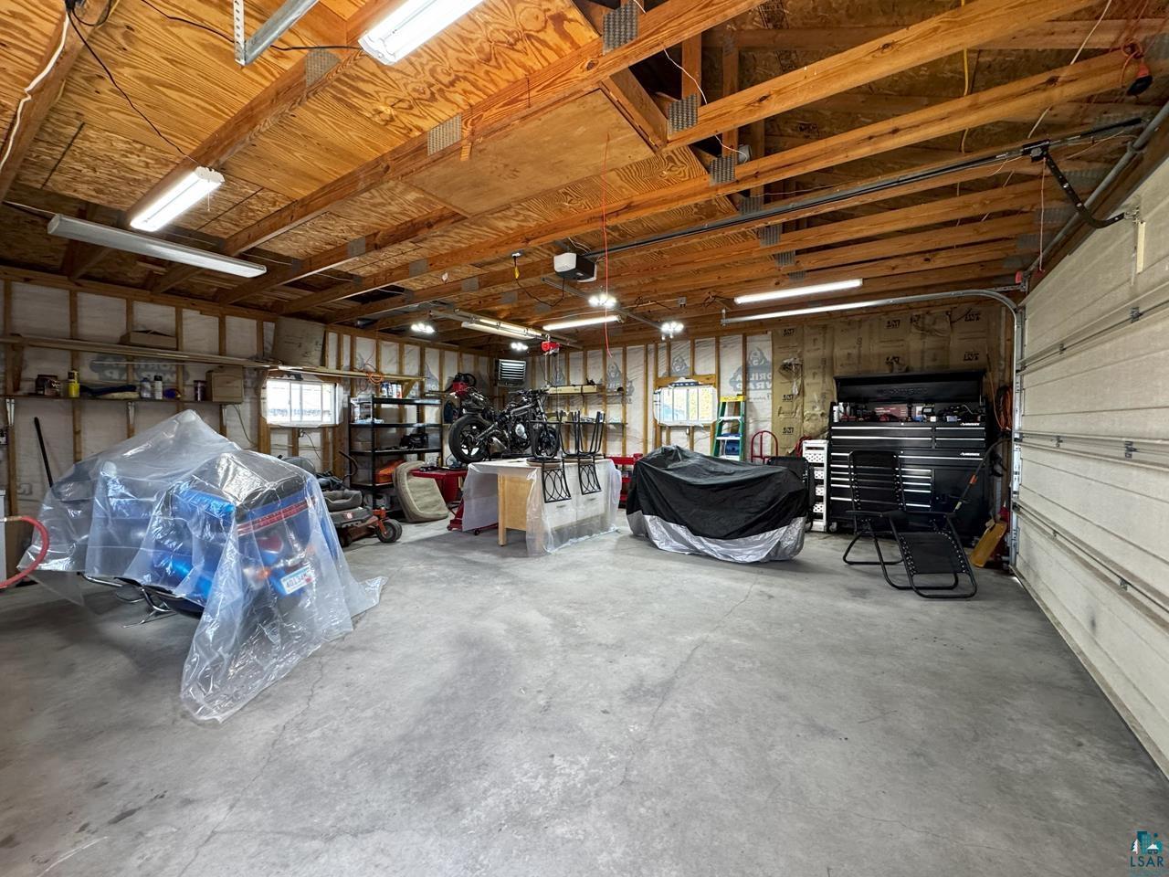 10362 Arkola Road Meadowlands, MN 55765 - Photo 20 of 30 Garage featuring a garage door opener