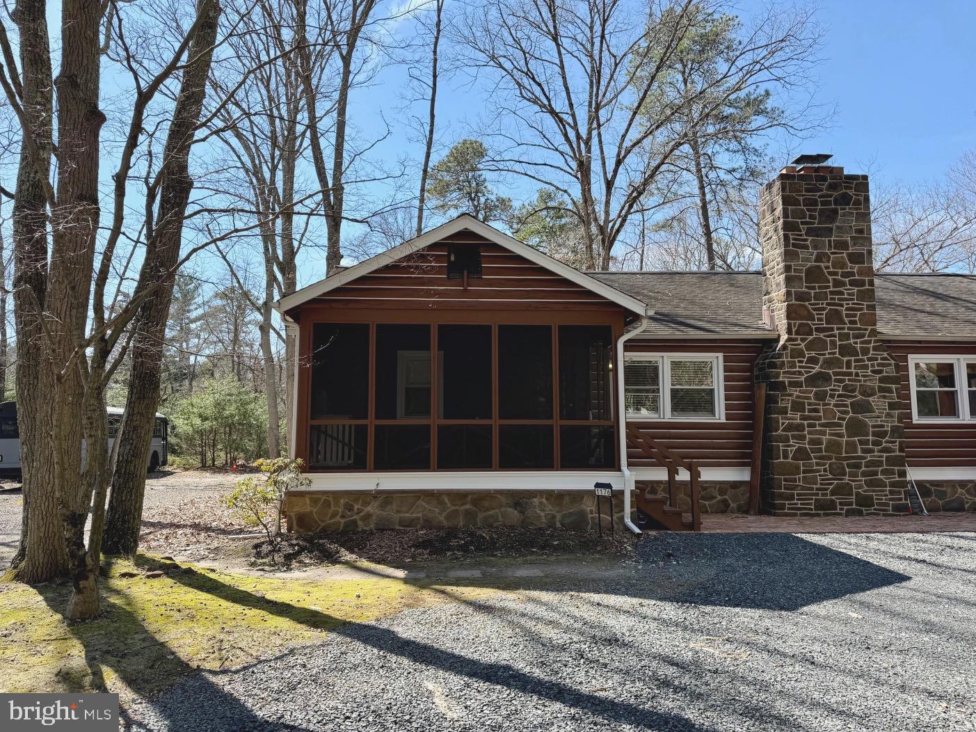 1176 Stokes Road Medford, NJ 08055 - Photo 1 of 27 a front view of a house with a yard and garage