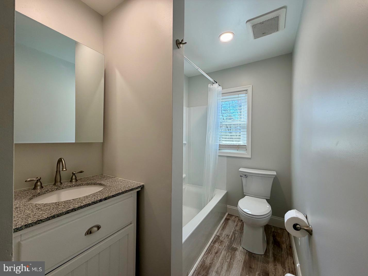 1176 Stokes Road Medford, NJ 08055 - Photo 12 of 27 a bathroom with a granite countertop toilet sink and mirror