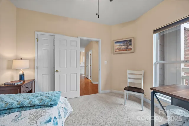 a bedroom with a bed and a table in it