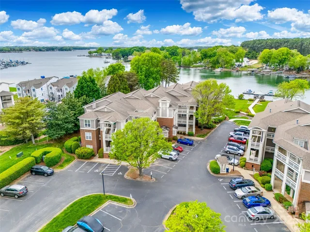 an aerial view of a house with yard swimming pool and outdoor seating