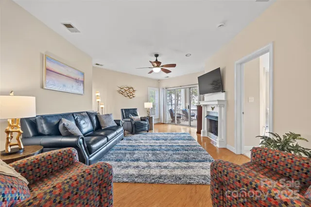 a living room with furniture fireplace and window