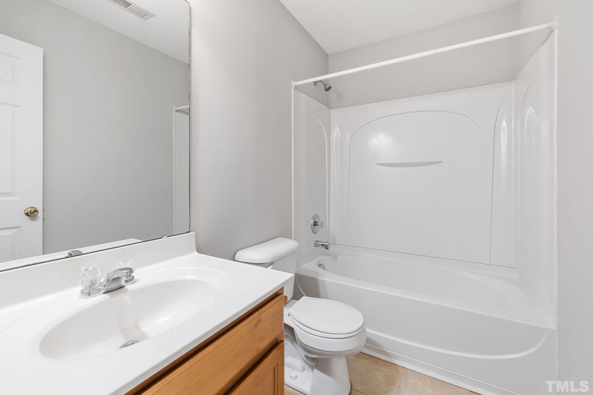 3519 Mountain Brook Circle Durham, NC 27704 - Photo 21 of 24 a bathroom with a sink toilet and shower